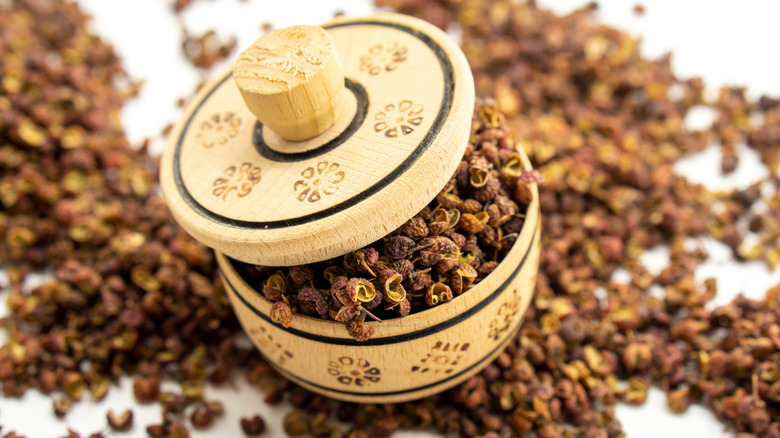 Red Sichuan peppercorns in a wooden pot