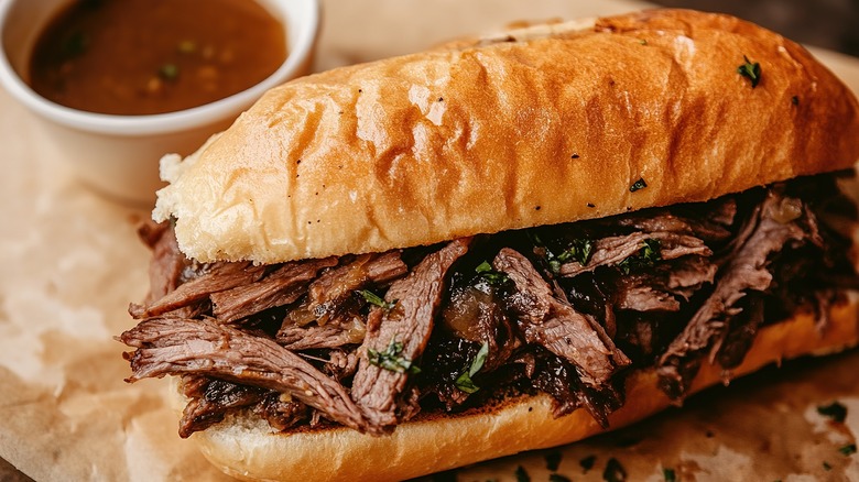 Close-up of French dip with herbs and jus