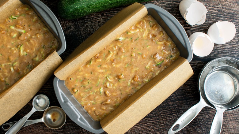 Pans filled with zucchini bread batter