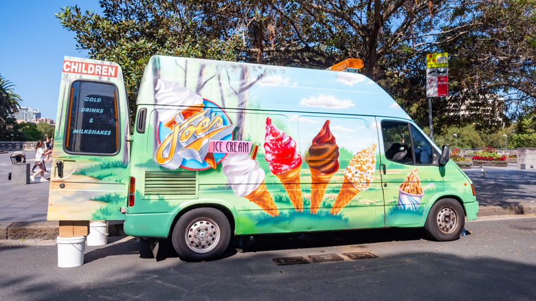 An ice cream truck with its door open.