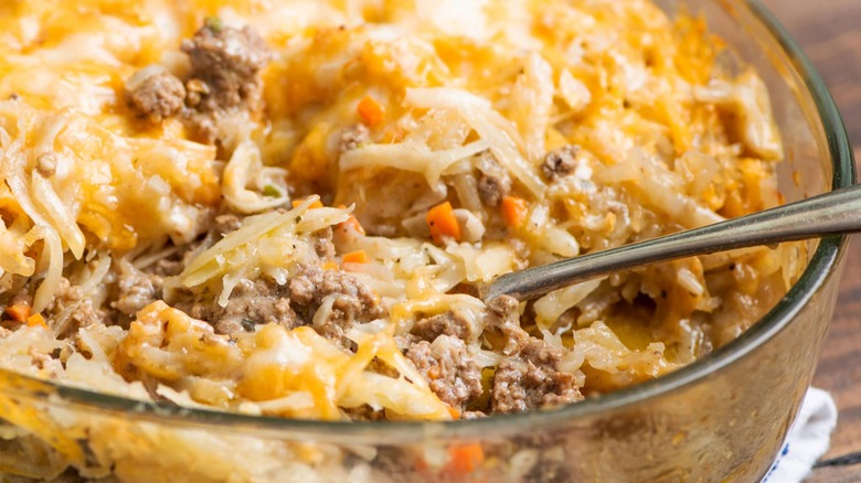 Shredded hash browns on top of a cheesy beef casserole