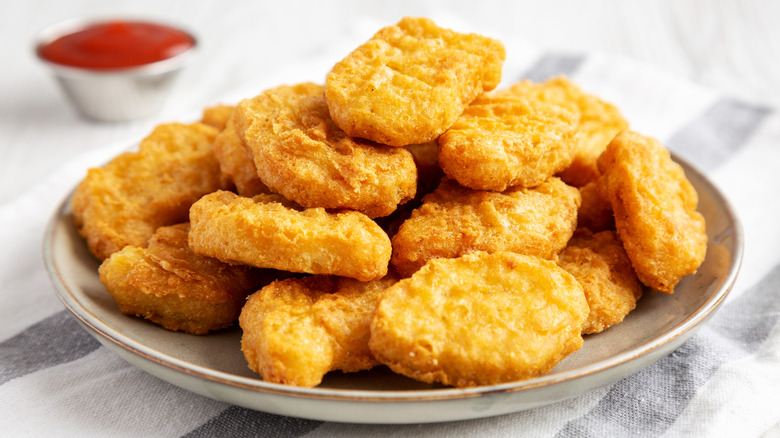 A plate of tempura battered chicken nuggets