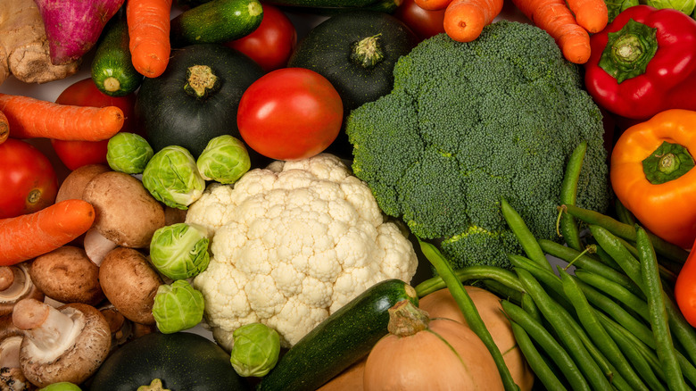 Butternut squash (bottom) sits beside several other fruits and vegetables