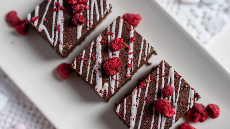 Freeze-dried raspberries with brownies on table