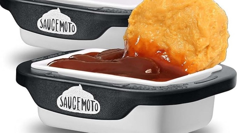 Chicken nugget and sauce in dip clip