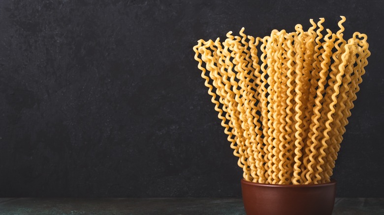 long dried fusilli noodles in a container