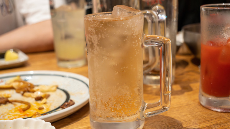 glass mug full of ginger ale on a restaurant table