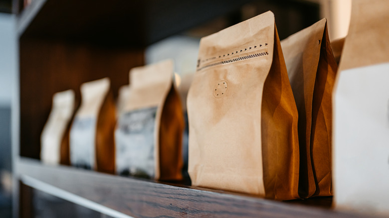 A shelf full of coffee bean bags