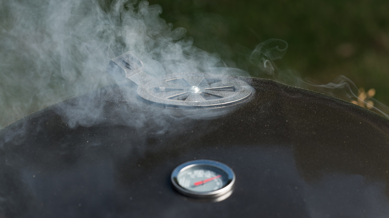 smoke coming out of closed grill