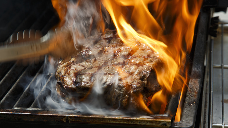 Rib eye steak on flame