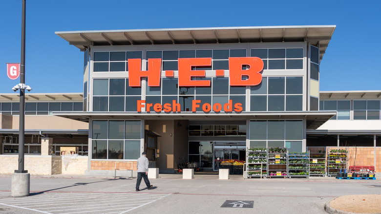 Man walking outside HEB store