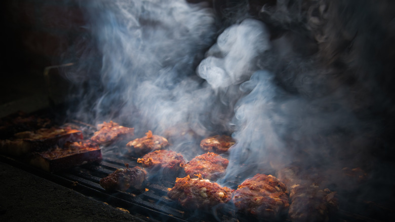 Beef smoking on a grill