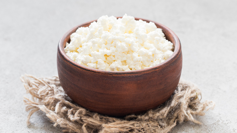 Wooden bowl of cottage cheese