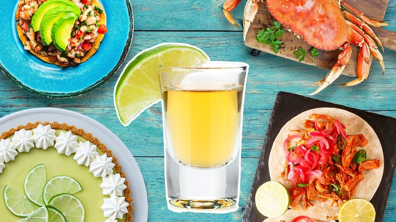 A shot of tequila surrounded by foods that pair well