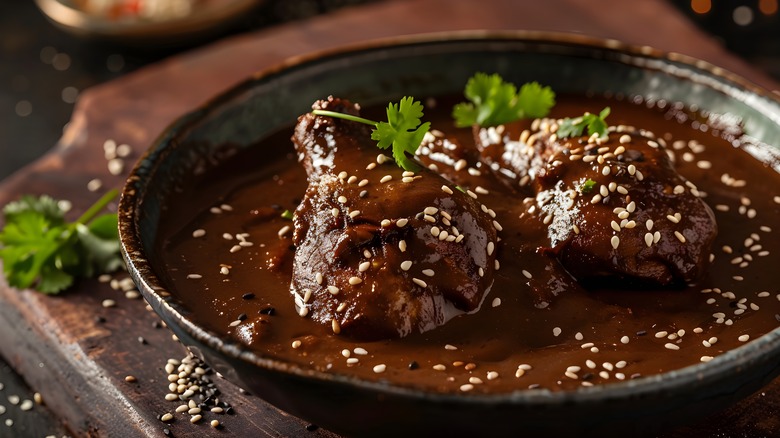 Chicken legs covered in mole sauce