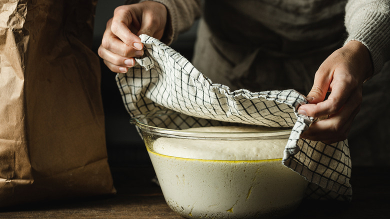 A towel laid over bread bowl