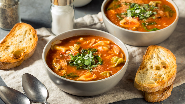 Two bowls of tortellini soup