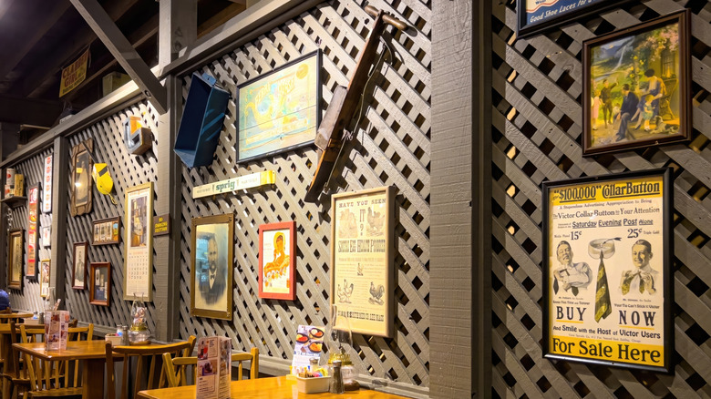 Antiques hang on the wall of a Cracker Barrel restaurant.