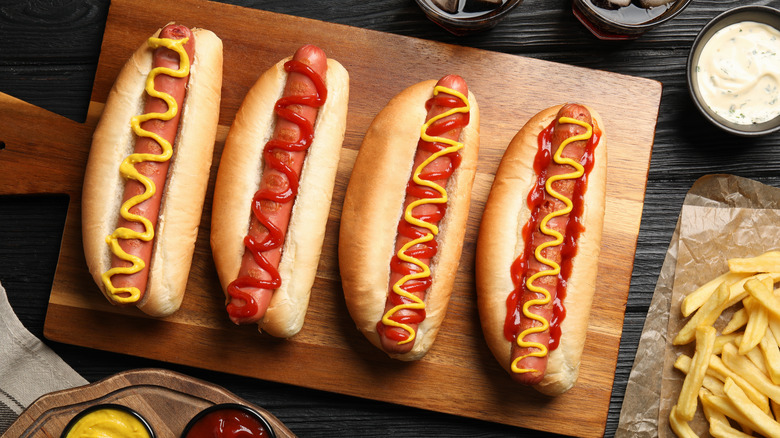 Hot dogs on wooden table