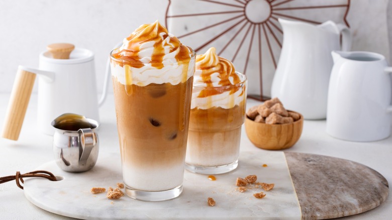 Iced caramel lattes on table