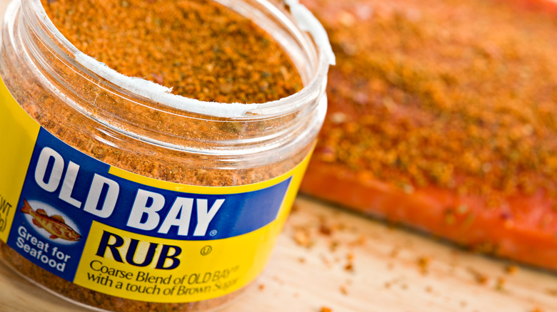 An opened jar of Old Bay in closeup.