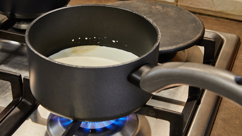 Scalding milk in sauce pan 