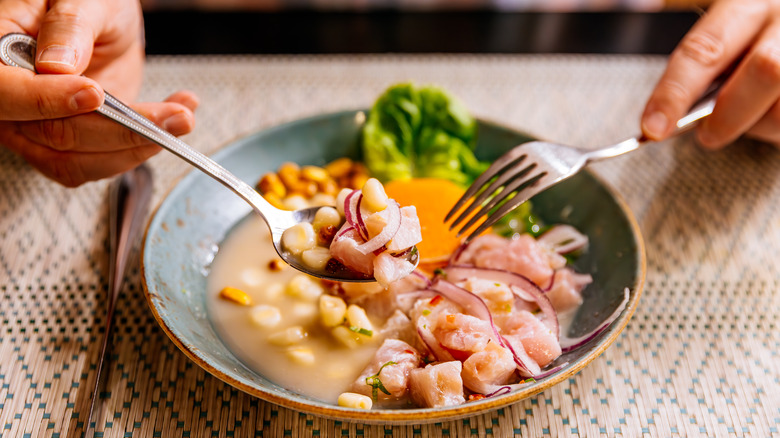 diner enjoying Peruvian ceviche