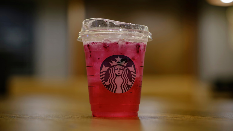 Pink mango dragonfruit refresher in Starbucks cup
