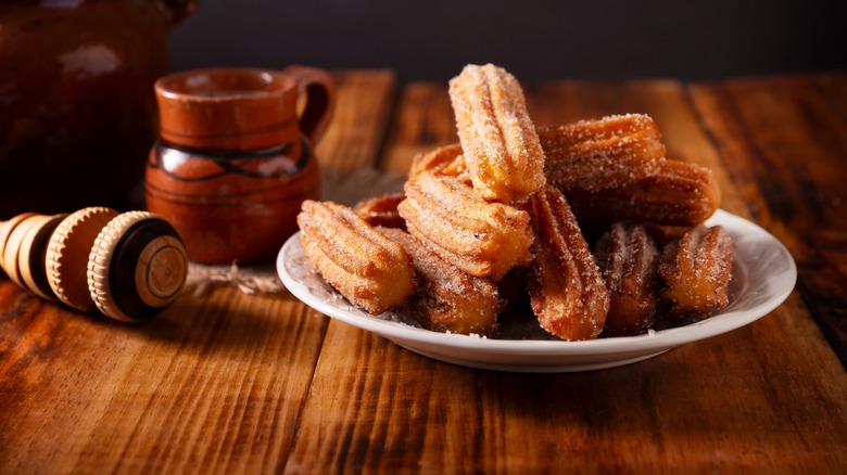 Churros piled on a plate