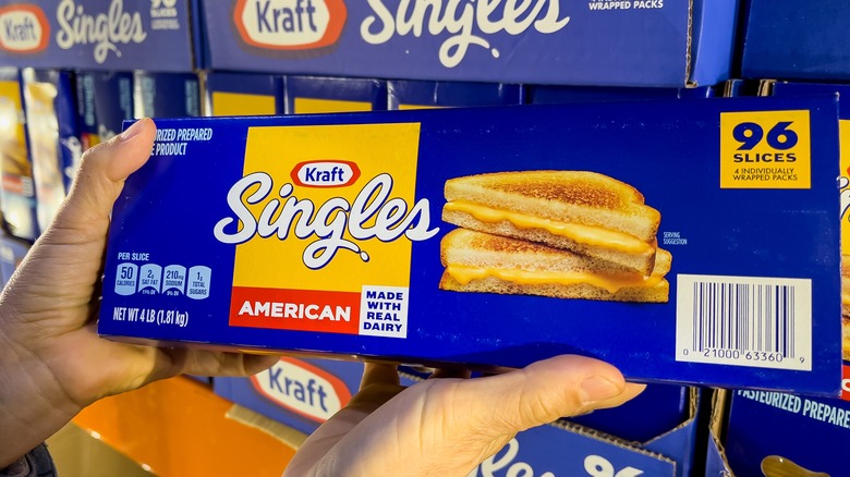 hands holding package of Kraft singles