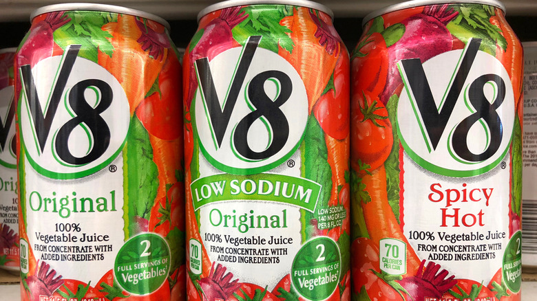 cans of V8 on supermarket shelf