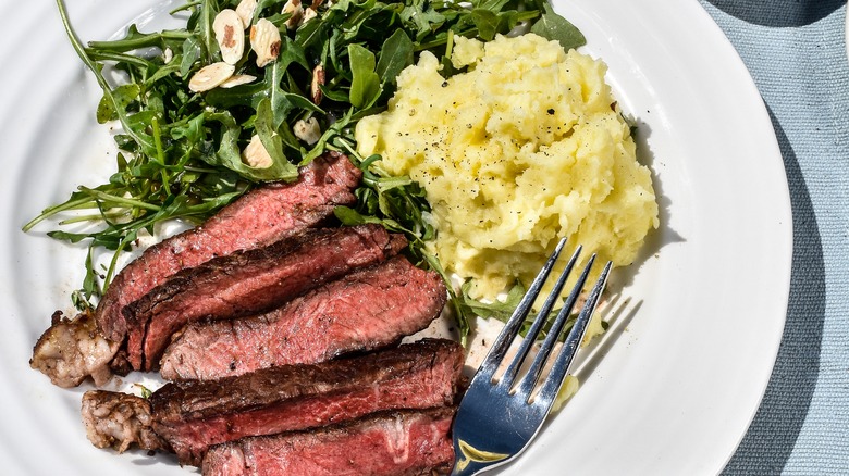 Flank steak, mashed potatoes, salad