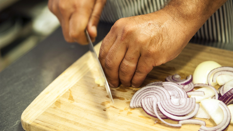 Chopping onions on a cutting board