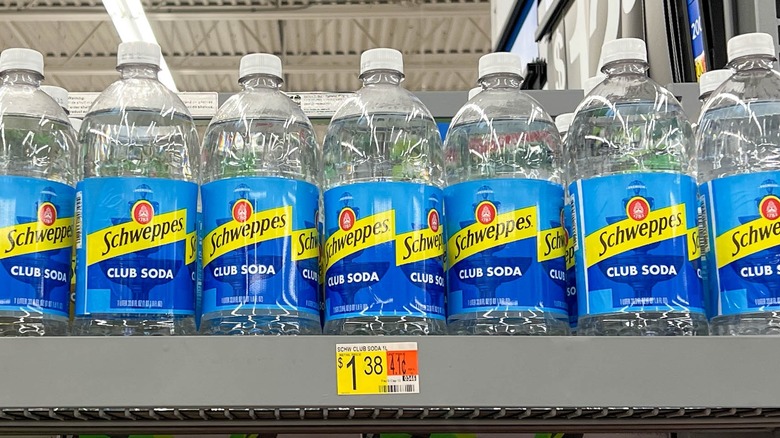 Bottles of club soda on a store shelf