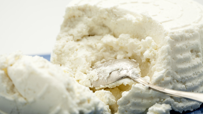Ricotta broken up with a spoon