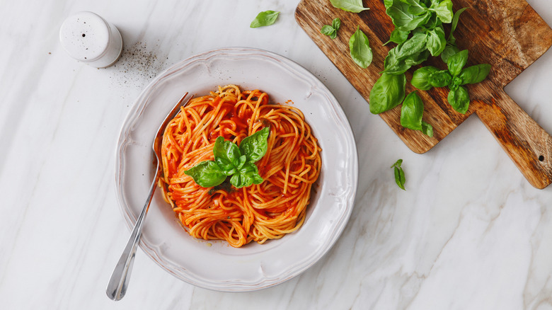 Spaghetti with side of basil