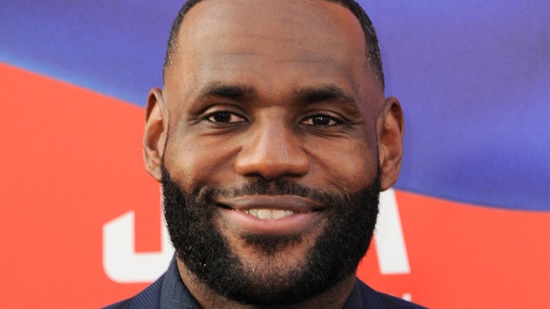 NBA player LeBron James smiles on the red carpet
