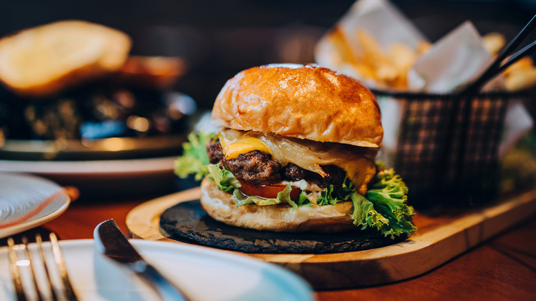 Cheeseburger on wooden board