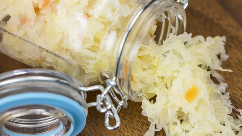 Closeup of sauerkraut spilling out of a jar