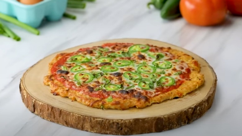 chicken crust pizza on a serving board