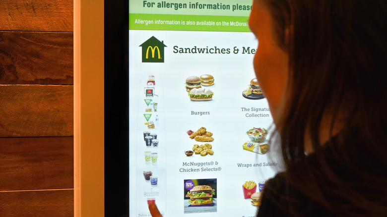 Person ordering on McDonald's touch screen menu