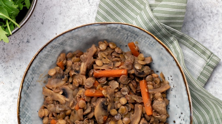 Mushrooms, lentils, and carrots in bowl