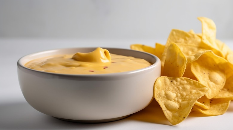 Cheese sauce next to chips