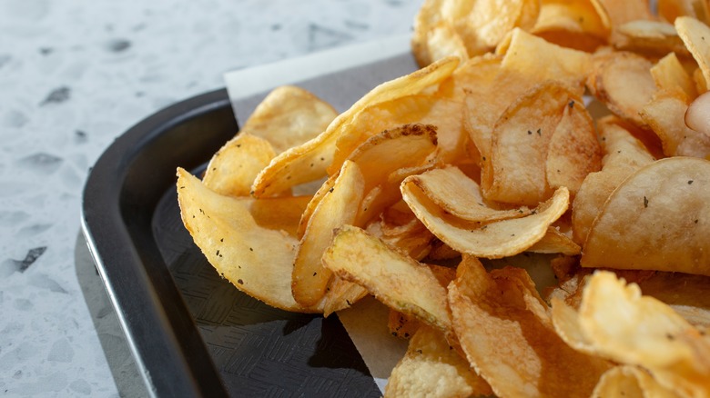 Crispy potato chips on a sheet pan