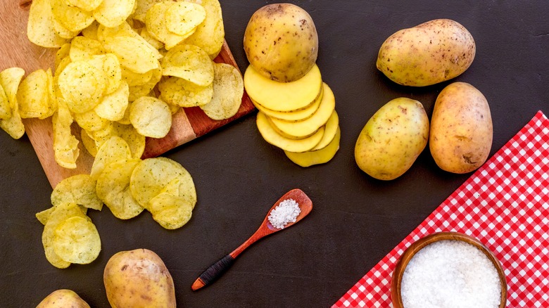 Potatoes in different stages of chip-making