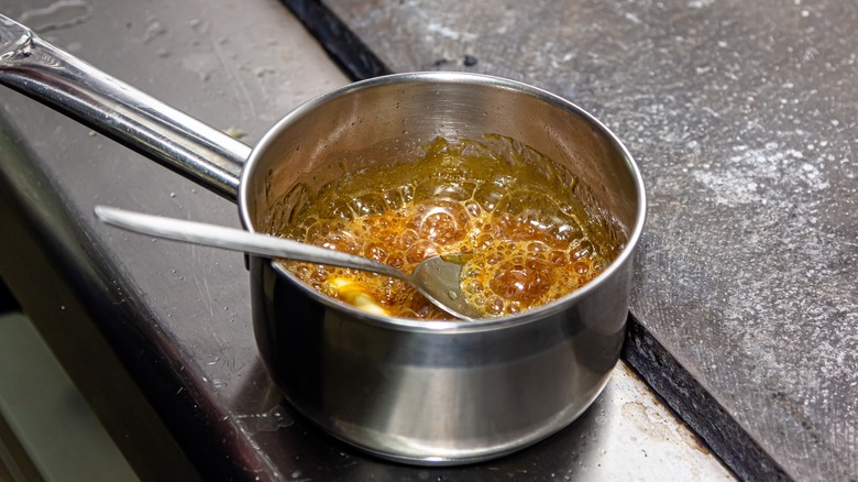 Bubbling caramel in a pot
