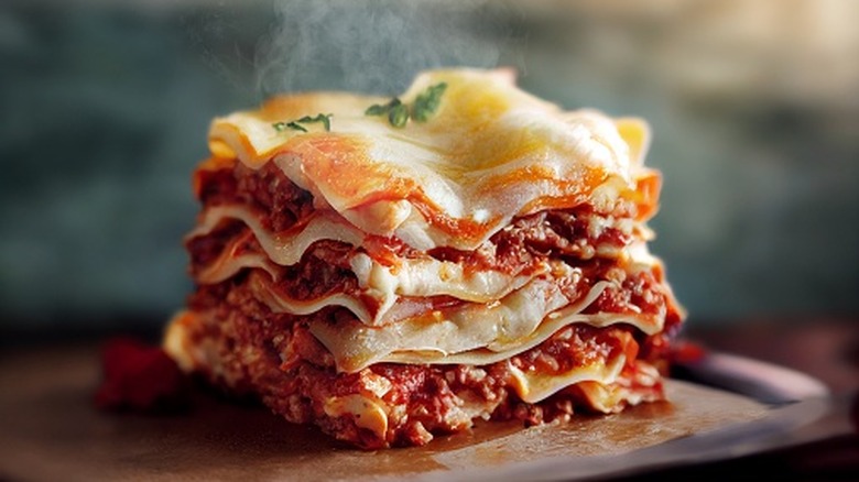 A steaming cube of layered lasagna