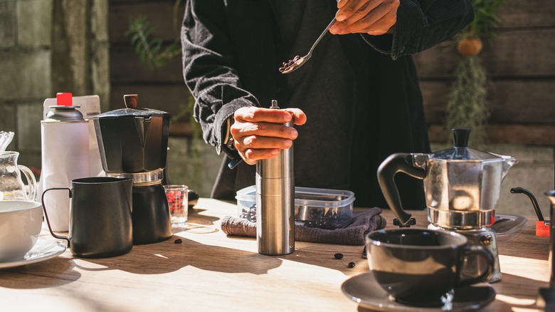 Barista preparing to grind coffee