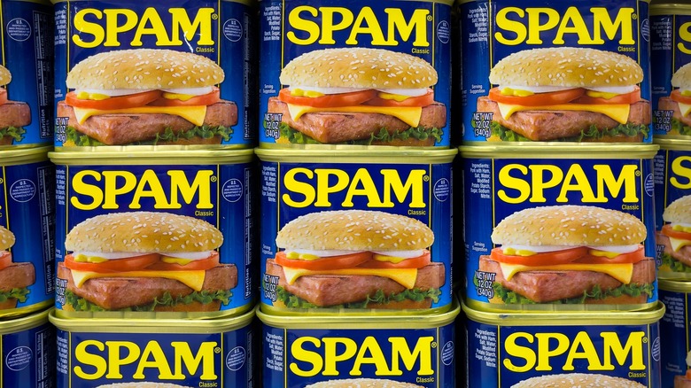 A wall of Spam cans on a store shelf