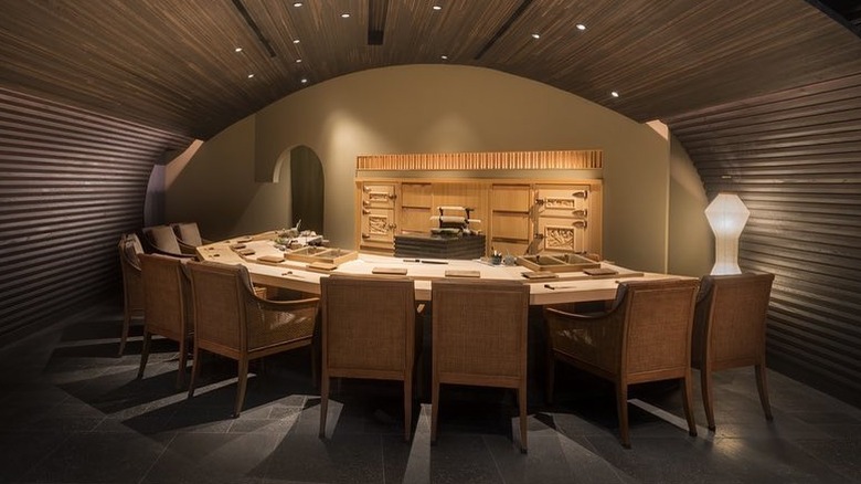 A wood paneled omakase dining room